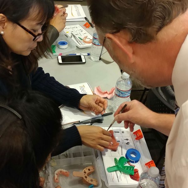 Dr. Cooper demonstrates TeethXpress to dentists at a seminar
