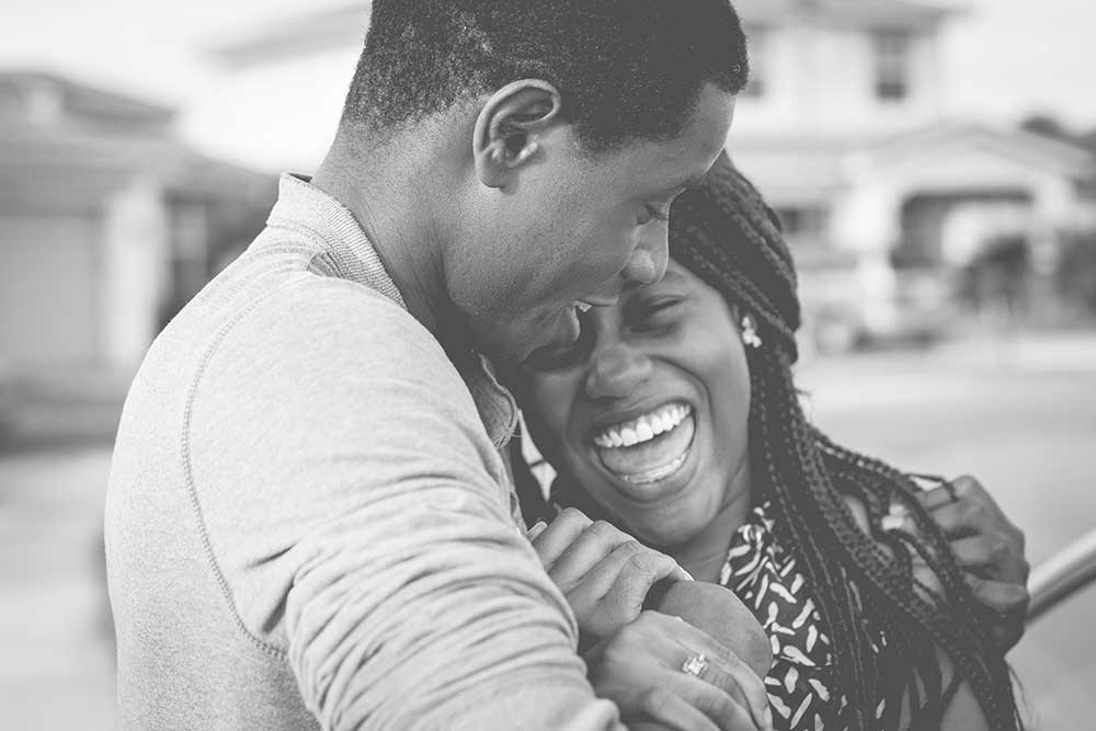 A happy woman laughing with her husband