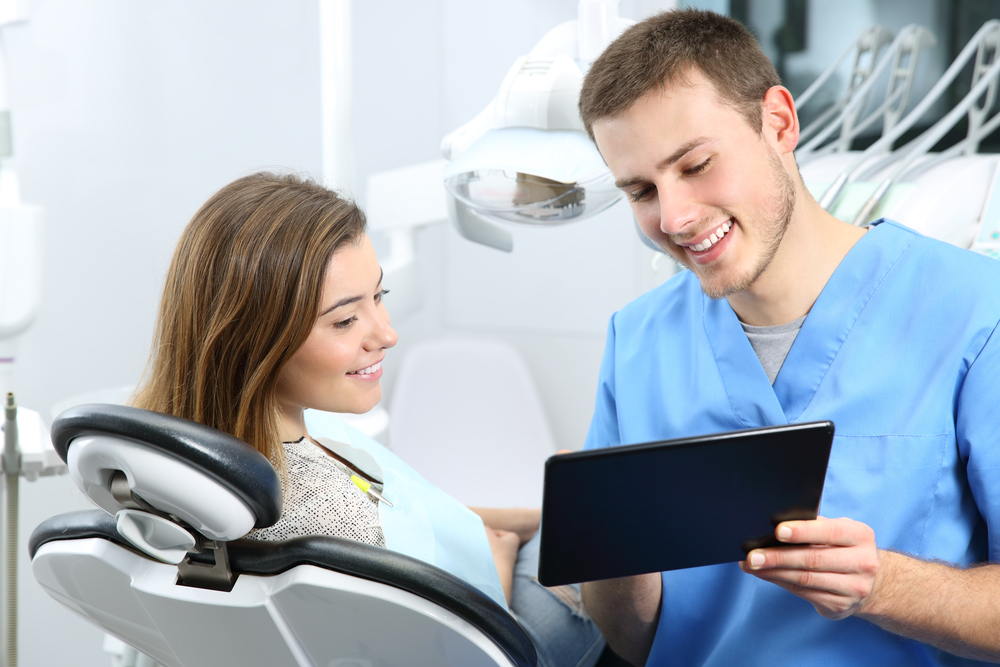 dentist consulting with patient